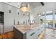 A kitchen island with stainless steel sinks and white and gray stone countertops at 430 Fish Tale Rd, Charleston, SC 29492