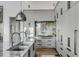 Spacious kitchen with gray cabinets, marble backsplash, countertop and stainless steel appliances at 430 Fish Tale Rd, Charleston, SC 29492