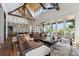 Spacious living room with high ceilings, wood beams, and large windows offering abundant natural light at 430 Fish Tale Rd, Charleston, SC 29492