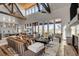 Spacious living room with high ceilings, expansive windows, and modern furnishings, creating an inviting atmosphere at 430 Fish Tale Rd, Charleston, SC 29492