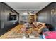 Cozy living room featuring a leather sectional, ceiling fan, and brick accents at 430 Fish Tale Rd, Charleston, SC 29492
