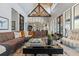 Expansive living room featuring vaulted ceilings, exposed beams, and an open-concept design at 430 Fish Tale Rd, Charleston, SC 29492
