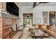 Comfortable living room with a brick fireplace, views to the outside, and a large sectional sofa at 430 Fish Tale Rd, Charleston, SC 29492