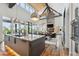 Open-concept living and kitchen area with hardwood floors and white shiplap walls at 430 Fish Tale Rd, Charleston, SC 29492