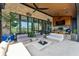 A covered patio area, featuring comfortable seating, outdoor kitchen and green outdoor space at 430 Fish Tale Rd, Charleston, SC 29492