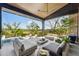 Luxurious outdoor space with comfortable seating, a ceiling fan, and marsh views, ideal for entertaining or relaxing at 430 Fish Tale Rd, Charleston, SC 29492