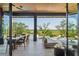Covered patio with outdoor dining, pool and expansive views of nature at 430 Fish Tale Rd, Charleston, SC 29492
