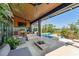 Inviting outdoor patio with outdoor kitchen and seating area, complemented by marsh views at 430 Fish Tale Rd, Charleston, SC 29492