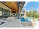Elegant outdoor patio features a relaxing lounge area, grill, and pool, ideal for entertainment at 430 Fish Tale Rd, Charleston, SC 29492
