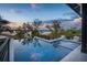 Modern infinity pool with sleek design, waterfront view, and comfortable lounge seating at 430 Fish Tale Rd, Charleston, SC 29492