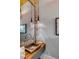 Powder room with copper sink, and brick wall mirror trim at 430 Fish Tale Rd, Charleston, SC 29492