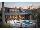 Modern brick home showcasing an outdoor living area with a pool, lounge seating and dining space at 430 Fish Tale Rd, Charleston, SC 29492