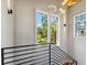 Staircase landing with lots of natural light and backyard views at 430 Fish Tale Rd, Charleston, SC 29492