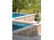 Beautiful infinity pool with a stone surround and landscaped accents, providing a relaxing retreat with stunning views at 430 Fish Tale Rd, Charleston, SC 29492