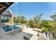 Luxury pool with a lounge area and waterfront views, perfect for relaxation and enjoying the panoramic scenery at 430 Fish Tale Rd, Charleston, SC 29492