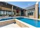 Outdoor living space with a custom pool, integrated seating, and outdoor kitchen, designed for an exceptional lifestyle at 430 Fish Tale Rd, Charleston, SC 29492