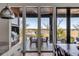 Beautiful outdoor view from the dining area featuring glass doors and marsh views at 430 Fish Tale Rd, Charleston, SC 29492