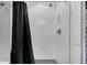 Bathroom features a clean and modern shower area, complemented by a sleek shower curtain and fixtures at 4445 Old Park Rd, North Charleston, SC 29405