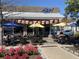 Outdoor seating beneath colorful umbrellas welcomes diners to enjoy a pleasant meal in a vibrant setting at 4445 Old Park Rd, North Charleston, SC 29405