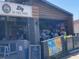 A relaxed outdoor setting with visible menu boards invites patrons to enjoy the sunshine and casual food at 4445 Old Park Rd, North Charleston, SC 29405
