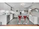Sleek kitchen featuring white cabinets, stainless steel appliances, a central island, and stylish red bar stools at 4445 Old Park Rd, North Charleston, SC 29405
