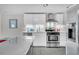 Modern kitchen with white cabinets, stainless steel appliances, and a stylish center island at 4445 Old Park Rd, North Charleston, SC 29405