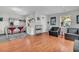 Spacious living room with hardwood floors, a modern kitchen, large windows, and comfortable seating at 4445 Old Park Rd, North Charleston, SC 29405