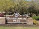 Sign for Quarterman Park, landscaped with mature trees and greenery, enhancing its welcoming appearance at 4445 Old Park Rd, North Charleston, SC 29405