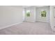 Spacious bedroom bathed in natural light, featuring soft carpeting and neutral walls at 482 Queenview Ln, Charleston, SC 29414