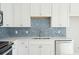 Contemporary kitchen featuring white cabinets, granite countertops, and stainless steel appliances, perfect for modern living at 482 Queenview Ln, Charleston, SC 29414