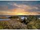 A beautiful aerial view of the waterfront homes and landscape at sunset at 5010 Timber Race Crse, Hollywood, SC 29449