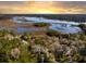 Beautiful aerial view of waterfront homes and landscape at sunset at 5010 Timber Race Crse, Hollywood, SC 29449