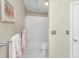 Cozy bathroom with a clean white shower curtain, modern toilet, and tiled floors at 5010 Timber Race Crse, Hollywood, SC 29449