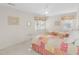 Bright bedroom featuring two twin beds with decorative quilts and neutral decor at 5010 Timber Race Crse, Hollywood, SC 29449