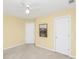 Bedroom featuring neutral carpet and trim with ceiling fan and two interior doors at 5010 Timber Race Crse, Hollywood, SC 29449