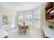 Breakfast nook with a round table, four chairs, and adjacent doors to the deck at 5010 Timber Race Crse, Hollywood, SC 29449