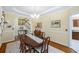 Inviting dining room with hardwood floors, staircase access, and decorative chandelier at 5010 Timber Race Crse, Hollywood, SC 29449