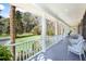 Inviting front porch with ample seating overlooking manicured lawn at 5010 Timber Race Crse, Hollywood, SC 29449