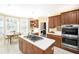 Kitchen with an island cooktop, stainless steel appliances, and adjacent breakfast area at 5010 Timber Race Crse, Hollywood, SC 29449