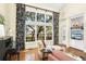 Bright living room features a piano, large windows with a view, and comfortable seating at 5010 Timber Race Crse, Hollywood, SC 29449