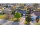Aerial view of a property with solar panels, lush greenery, and a driveway with car at 503 Amberjack Way, Summerville, SC 29485