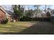 Large backyard with well-maintained lawn and a wooden fence at 503 Amberjack Way, Summerville, SC 29485