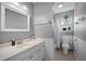 Bathroom featuring a single sink vanity, mirror, shower-tub combination with toilet at 503 Amberjack Way, Summerville, SC 29485
