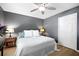 Bedroom with ceiling fan, gray walls, and a closet with a white door at 503 Amberjack Way, Summerville, SC 29485
