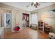 Bedroom with hardwood floors, view to closet, doorway, and a play area at 503 Amberjack Way, Summerville, SC 29485