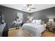 Bedroom featuring a bed, gray walls, ceiling fan and bright natural light at 503 Amberjack Way, Summerville, SC 29485