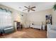 Bedroom with a crib, rocking chair, bookcase, and hardwood floors at 503 Amberjack Way, Summerville, SC 29485