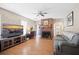 Cozy living room with brick fireplace, wood floors, and modern furnishings at 503 Amberjack Way, Summerville, SC 29485