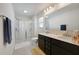 Bright bathroom featuring a double vanity, spacious shower with glass doors, and soft lighting at 509 Purple Finch Rd, Summerville, SC 29486