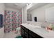 Bathroom with double sink vanity, decorated shower curtain and tile flooring at 509 Purple Finch Rd, Summerville, SC 29486